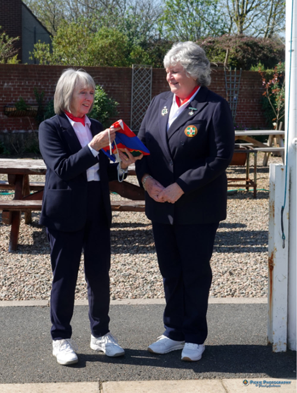 NIWPGL President Elizabeth Blair and Past President Nan McBride MBE at the 2025 Flag Unfurling at Pickie BC